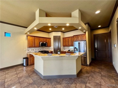 This spacious 2-story custom pool home in the gated Los Lagos on Los Lagos Golf Club in Arizona - for sale on GolfHomes.com, golf home, golf lot