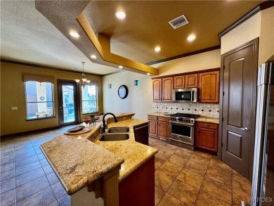 This spacious 2-story custom pool home in the gated Los Lagos on Los Lagos Golf Club in Arizona - for sale on GolfHomes.com, golf home, golf lot