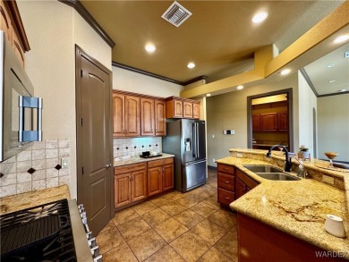 This spacious 2-story custom pool home in the gated Los Lagos on Los Lagos Golf Club in Arizona - for sale on GolfHomes.com, golf home, golf lot