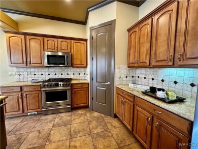 This spacious 2-story custom pool home in the gated Los Lagos on Los Lagos Golf Club in Arizona - for sale on GolfHomes.com, golf home, golf lot