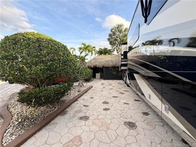 Discover a true g?m th?t r?define? luxur? and outdoor living! on St. Lucie Trail Golf Club in Florida - for sale on GolfHomes.com, golf home, golf lot