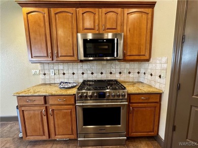 This spacious 2-story custom pool home in the gated Los Lagos on Los Lagos Golf Club in Arizona - for sale on GolfHomes.com, golf home, golf lot
