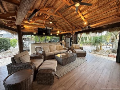 Discover a true g?m th?t r?define? luxur? and outdoor living! on St. Lucie Trail Golf Club in Florida - for sale on GolfHomes.com, golf home, golf lot