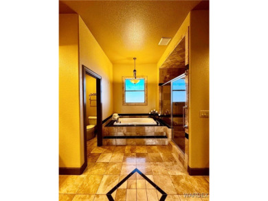 This spacious 2-story custom pool home in the gated Los Lagos on Los Lagos Golf Club in Arizona - for sale on GolfHomes.com, golf home, golf lot