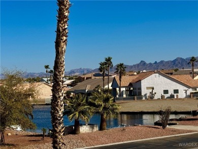 This spacious 2-story custom pool home in the gated Los Lagos on Los Lagos Golf Club in Arizona - for sale on GolfHomes.com, golf home, golf lot
