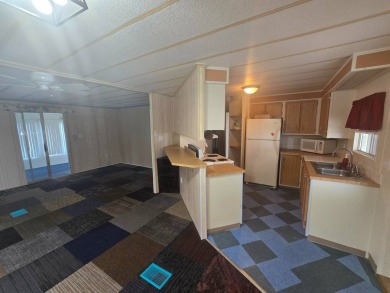 Charming & Renovated 2-Bedroom, 2-Bath Double-Wide in Vibrant on Vista Plantation Golf Club in Florida - for sale on GolfHomes.com, golf home, golf lot