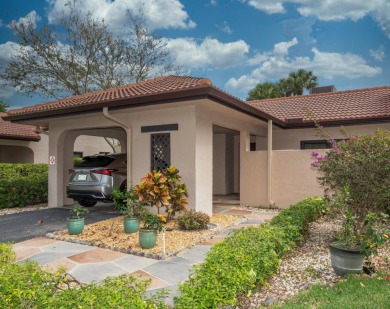 Discover an impeccable, fully renovated 2BR/2BA waterfront villa on Boca Lago Golf and Country Club in Florida - for sale on GolfHomes.com, golf home, golf lot