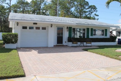 Welcome to this stunning and updated Baldwin model home on Mainlands Golf Club in Florida - for sale on GolfHomes.com, golf home, golf lot