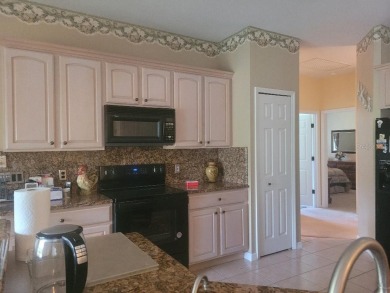 This is a MUST SEE....waiting on your personal touches. Exterior on Stonegate Golf Club in Florida - for sale on GolfHomes.com, golf home, golf lot