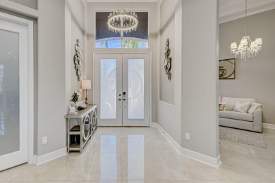 Discover unparalleled elegance in this stunning 3-bedroom on PGA National Estates Golf Course in Florida - for sale on GolfHomes.com, golf home, golf lot