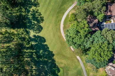 A Tuscan-style upper-level unit featuring a primary suite on the on Keowee Key Golf and Country Club in South Carolina - for sale on GolfHomes.com, golf home, golf lot