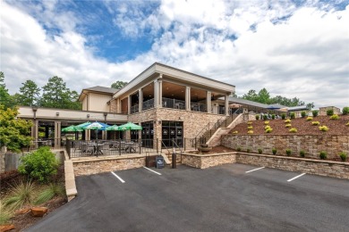 A Tuscan-style upper-level unit featuring a primary suite on the on Keowee Key Golf and Country Club in South Carolina - for sale on GolfHomes.com, golf home, golf lot