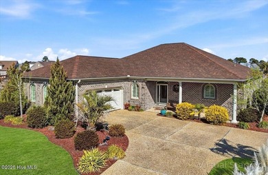 Experience the pinnacle of coastal living in this custom-built on Magnolia Greens Golf Plantation in North Carolina - for sale on GolfHomes.com, golf home, golf lot