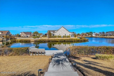 Experience the pinnacle of coastal living in this custom-built on Magnolia Greens Golf Plantation in North Carolina - for sale on GolfHomes.com, golf home, golf lot