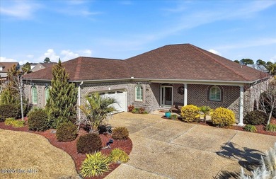 Experience the pinnacle of coastal living in this custom-built on Magnolia Greens Golf Plantation in North Carolina - for sale on GolfHomes.com, golf home, golf lot