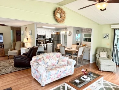 Discover this charming two-bedroom, two-bathroom home in the on Pine Lakes Country Club in Florida - for sale on GolfHomes.com, golf home, golf lot