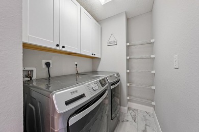 Exquisitely transformed residence in the Spanish-inspired on PGA National Golf Club in Florida - for sale on GolfHomes.com, golf home, golf lot