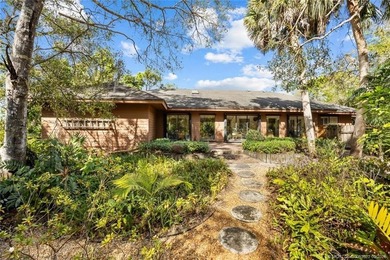 Discover a rare, tropical, secret garden within the gated on Martin Downs Country Club in Florida - for sale on GolfHomes.com, golf home, golf lot