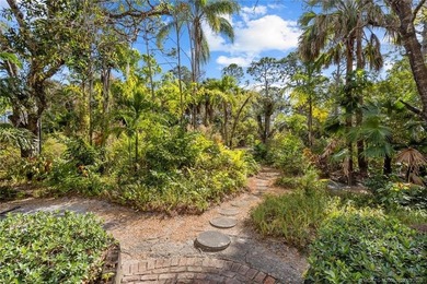 Discover a rare, tropical, secret garden within the gated on Martin Downs Country Club in Florida - for sale on GolfHomes.com, golf home, golf lot