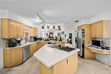 Discover a rare, tropical, secret garden within the gated on Martin Downs Country Club in Florida - for sale on GolfHomes.com, golf home, golf lot