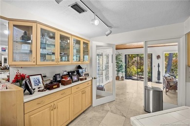 Discover a rare, tropical, secret garden within the gated on Martin Downs Country Club in Florida - for sale on GolfHomes.com, golf home, golf lot