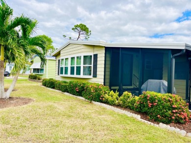 Discover this charming two-bedroom, two-bathroom home in the on Pine Lakes Country Club in Florida - for sale on GolfHomes.com, golf home, golf lot