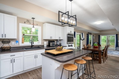 Welcome to 309 Woodview, a beautifully reimagined 4-bedroom on Eagle Island Golf Club in Michigan - for sale on GolfHomes.com, golf home, golf lot