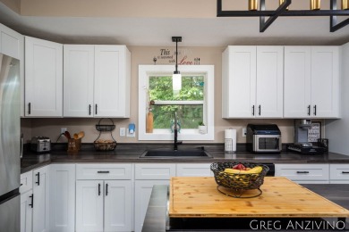 Welcome to 309 Woodview, a beautifully reimagined 4-bedroom on Eagle Island Golf Club in Michigan - for sale on GolfHomes.com, golf home, golf lot