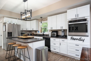 Welcome to 309 Woodview, a beautifully reimagined 4-bedroom on Eagle Island Golf Club in Michigan - for sale on GolfHomes.com, golf home, golf lot