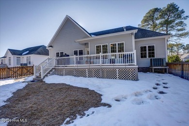 Welcome to 2022 Caracara Drive, where refined finishes meet on Harbour Point Golf Club in North Carolina - for sale on GolfHomes.com, golf home, golf lot