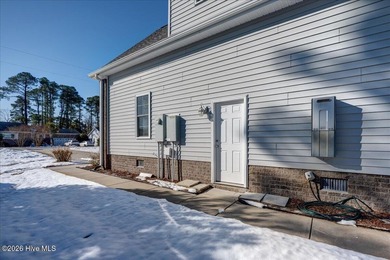 Welcome to 2022 Caracara Drive, where refined finishes meet on Harbour Point Golf Club in North Carolina - for sale on GolfHomes.com, golf home, golf lot