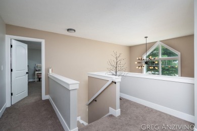 Welcome to 309 Woodview, a beautifully reimagined 4-bedroom on Eagle Island Golf Club in Michigan - for sale on GolfHomes.com, golf home, golf lot