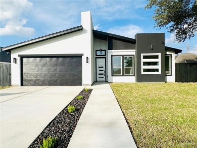 Welcome to this modern 4-bedroom, 2-bathroom home in Edinburg on Los Lagos Golf Club in Texas - for sale on GolfHomes.com, golf home, golf lot