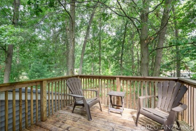 Welcome to 309 Woodview, a beautifully reimagined 4-bedroom on Eagle Island Golf Club in Michigan - for sale on GolfHomes.com, golf home, golf lot