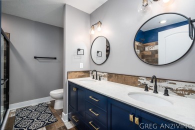 Welcome to 309 Woodview, a beautifully reimagined 4-bedroom on Eagle Island Golf Club in Michigan - for sale on GolfHomes.com, golf home, golf lot