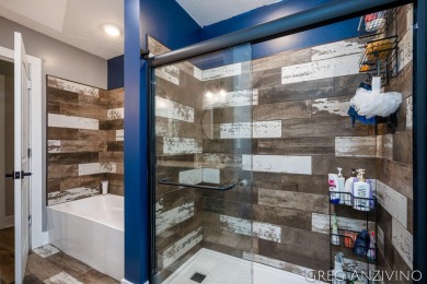 Welcome to 309 Woodview, a beautifully reimagined 4-bedroom on Eagle Island Golf Club in Michigan - for sale on GolfHomes.com, golf home, golf lot