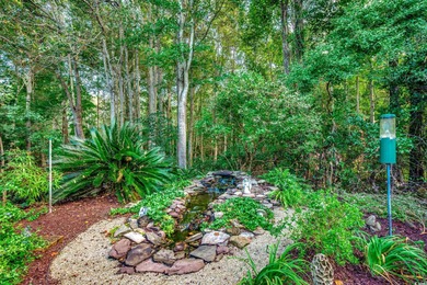 This beautifully landscaped home is a nature lovers paradise on Wachesaw Plantation East Golf Course in South Carolina - for sale on GolfHomes.com, golf home, golf lot