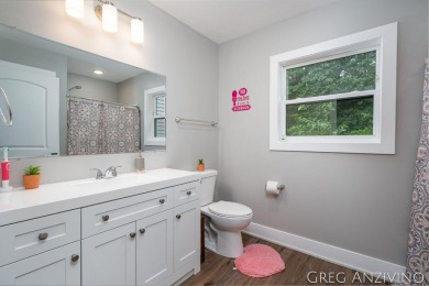 Welcome to 309 Woodview, a beautifully reimagined 4-bedroom on Eagle Island Golf Club in Michigan - for sale on GolfHomes.com, golf home, golf lot
