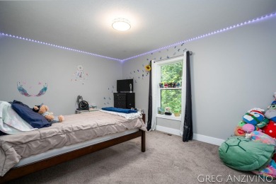 Welcome to 309 Woodview, a beautifully reimagined 4-bedroom on Eagle Island Golf Club in Michigan - for sale on GolfHomes.com, golf home, golf lot
