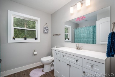 Welcome to 309 Woodview, a beautifully reimagined 4-bedroom on Eagle Island Golf Club in Michigan - for sale on GolfHomes.com, golf home, golf lot
