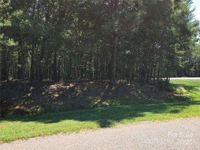 This Badin Lake waterfront lot is located in the prestigious on Old North State Club at Uwharrie Point Golf community in North Carolina - for sale on GolfHomes.com, golf home, golf lot