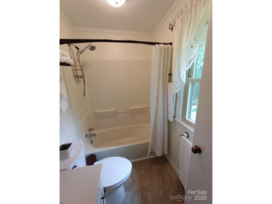 Charming and unique home nestled in Country Club Estates on Hendersonville Country Club in North Carolina - for sale on GolfHomes.com, golf home, golf lot