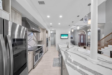 Tucked behind the private gates of the Bay Point community, this on Bay Point Resort Golf Club in Florida - for sale on GolfHomes.com, golf home, golf lot