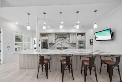 Tucked behind the private gates of the Bay Point community, this on Bay Point Resort Golf Club in Florida - for sale on GolfHomes.com, golf home, golf lot