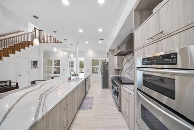 Tucked behind the private gates of the Bay Point community, this on Bay Point Resort Golf Club in Florida - for sale on GolfHomes.com, golf home, golf lot