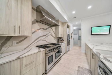 Tucked behind the private gates of the Bay Point community, this on Bay Point Resort Golf Club in Florida - for sale on GolfHomes.com, golf home, golf lot