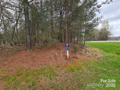 This Badin Lake waterfront lot is located in the prestigious on Old North State Club at Uwharrie Point Golf community in North Carolina - for sale on GolfHomes.com, golf home, golf lot