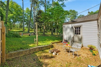 This adorable bungalow overlooks the Charlie Yates golf course on Charlie Yates Golf Course in Georgia - for sale on GolfHomes.com, golf home, golf lot