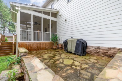 Relax in the sun-filled living spaces with hardwood floors on Heritage Golf Club in North Carolina - for sale on GolfHomes.com, golf home, golf lot
