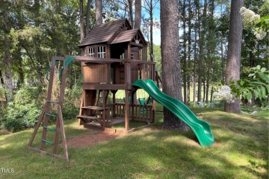 Relax in the sun-filled living spaces with hardwood floors on Heritage Golf Club in North Carolina - for sale on GolfHomes.com, golf home, golf lot